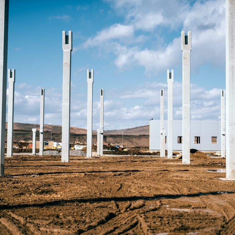 Installation and assembly of concrete precast pillars on construction site